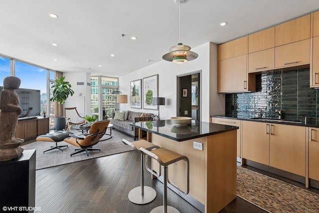 510 W Erie St Unit 1606, Chicago, IL 60654 - kitchen with open floor plan, a sink, decorative backsplash, recessed lighting, and a kitchen island