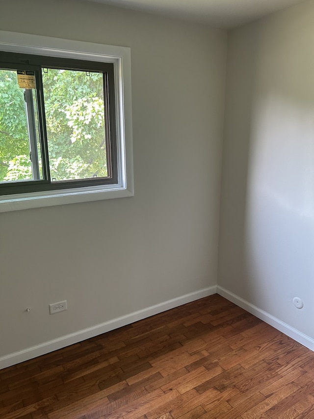 18W118 14th St, Villa Park, IL 60181 - empty room with dark wood-style flooring and baseboards