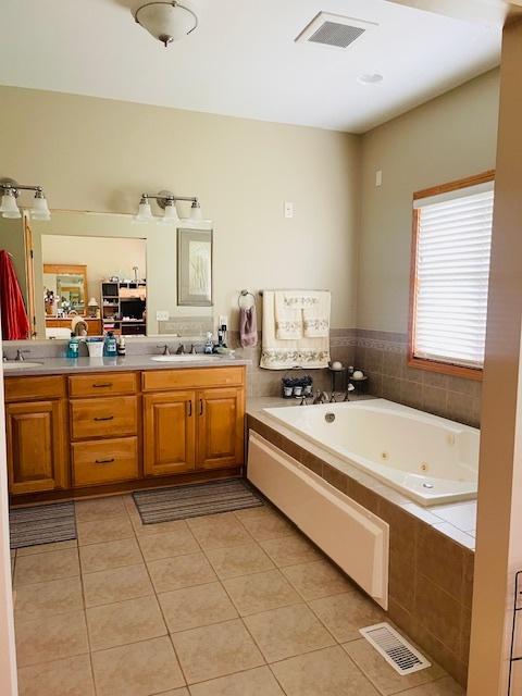 1976 E 24th Rd, Ransom, IL 60470 - full bath with tile patterned flooring, double vanity, and a tub with jets