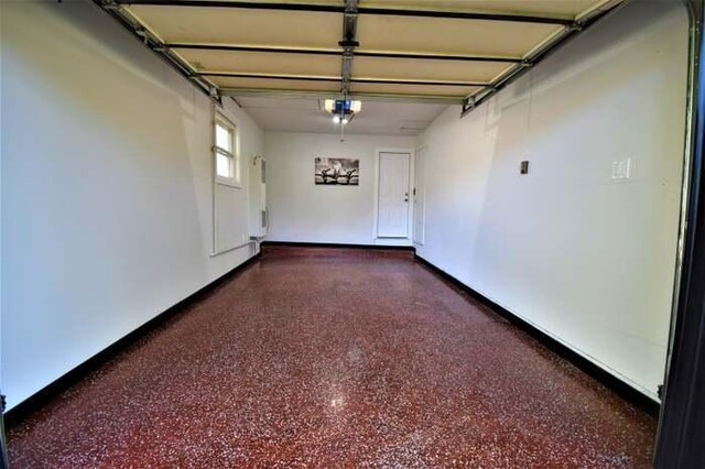 700 Delphia Ave, Elk Grove Village, IL 60007 - garage with a garage door opener and baseboards