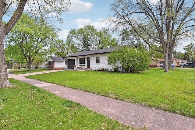 700 Delphia Ave, Elk Grove Village, IL 60007 - view of front of home featuring a garage, driveway, a front lawn, and a chimney