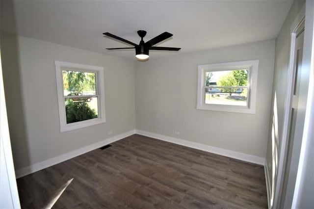 700 Delphia Ave, Elk Grove Village, IL 60007 - spare room with dark wood-style flooring, baseboards, and ceiling fan