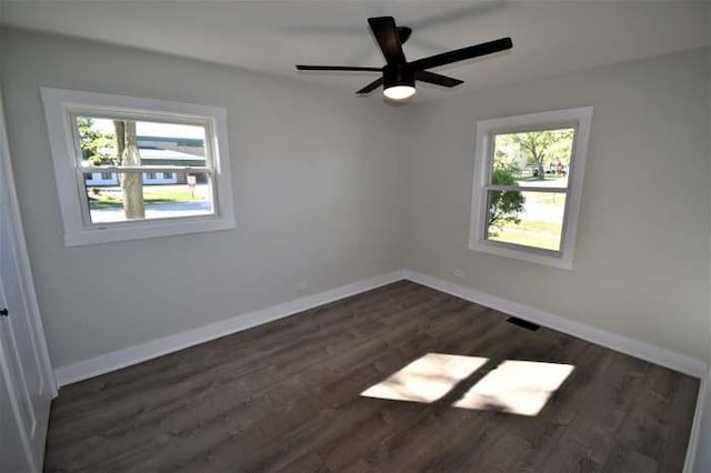 700 Delphia Ave, Elk Grove Village, IL 60007 - unfurnished room with dark wood-type flooring, baseboards, and a ceiling fan