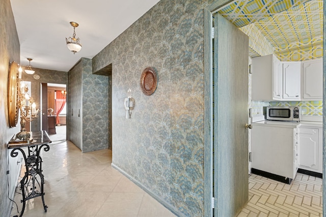 hallway featuring wallpapered walls