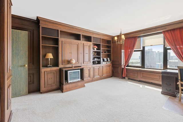 unfurnished living room featuring light colored carpet, a chandelier, an office area, and ornamental molding