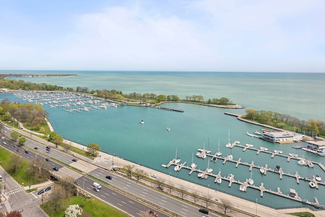bird's eye view of a large body of water, a main thoroughfare, and a marina