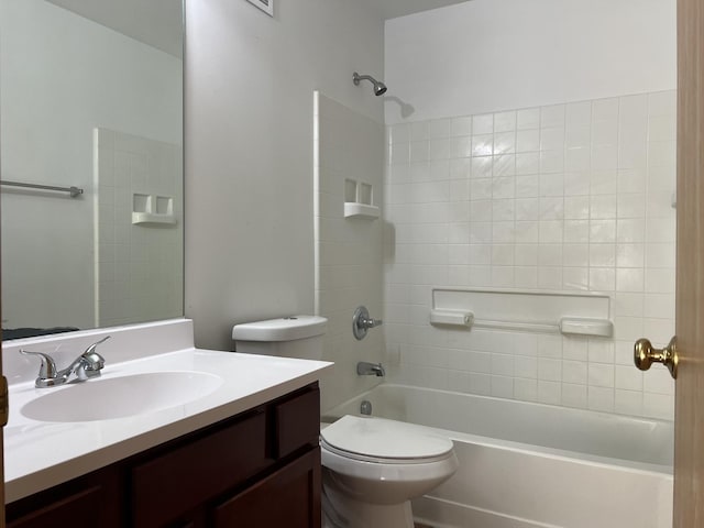 bathroom with toilet, vanity, and washtub / shower combination