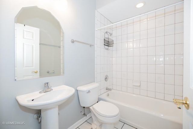 full bathroom with toilet, tub / shower combination, baseboards, and tile patterned floors