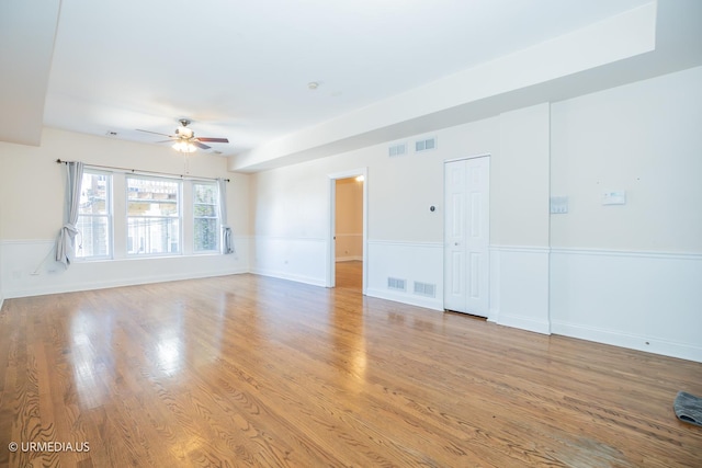 spare room featuring ceiling fan and light wood-type flooring