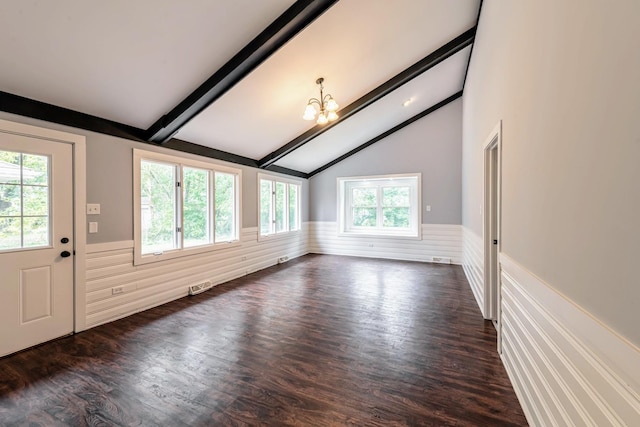 additional living space featuring wainscoting, a chandelier, and dark wood-type flooring