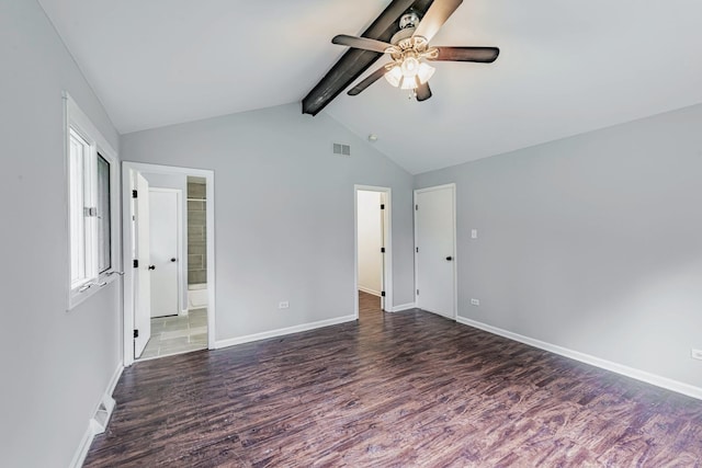 unfurnished bedroom with wood finished floors, baseboards, ensuite bathroom, and a ceiling fan