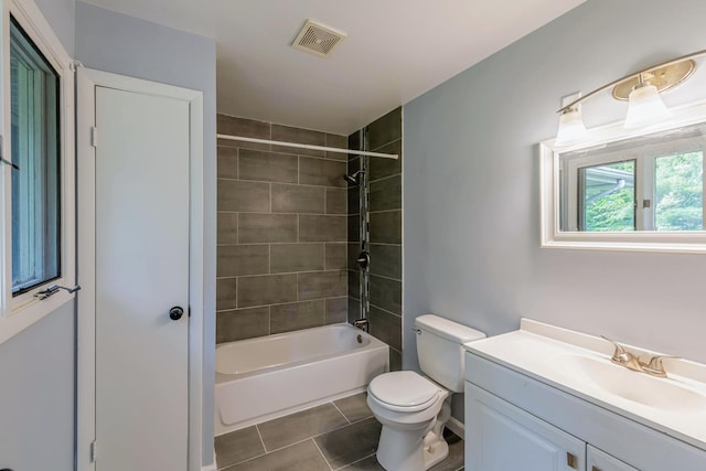 bathroom with tile patterned flooring, vanity, toilet, and tub / shower combination