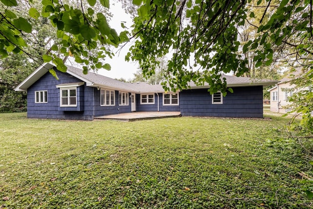 back of house with a lawn and a wooden deck