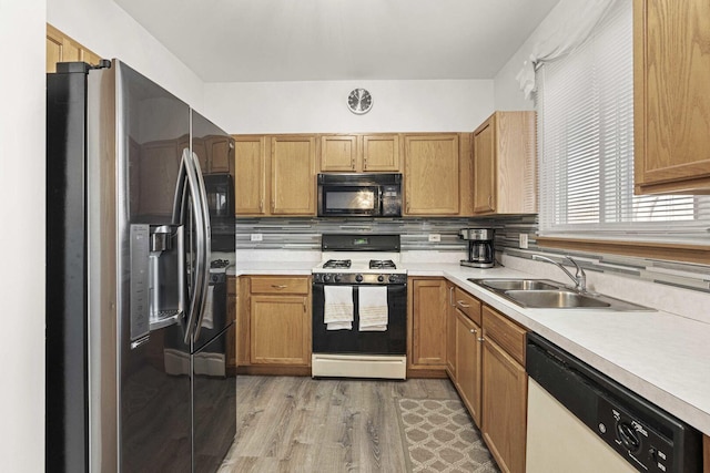 21628 Dogwood Rd Unit 120-3, Matteson, IL 60443 - kitchen with stainless steel refrigerator with ice dispenser, black microwave, gas range, white dishwasher, and a sink