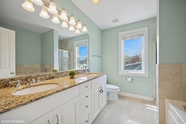 209 S Evergreen Ave, Arlington Heights, IL 60005 - full bathroom with a stall shower, baseboards, double vanity, a bathtub, and tile patterned floors