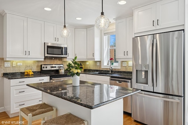 209 S Evergreen Ave, Arlington Heights, IL 60005 - kitchen with stainless steel appliances, a sink, white cabinets, tasteful backsplash, and recessed lighting