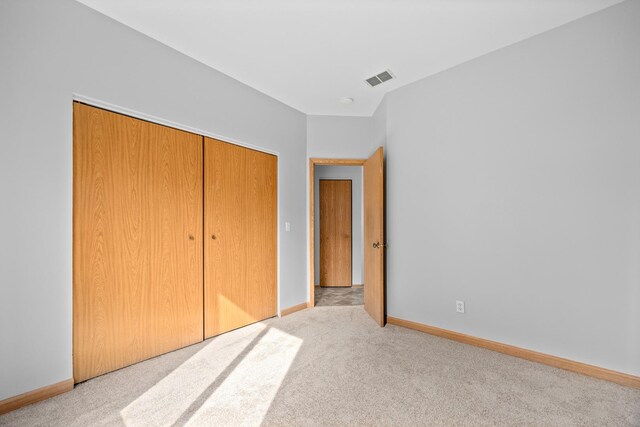 21315 W Edison Ln, Plainfield, IL 60544 - unfurnished bedroom featuring carpet, a closet, and baseboards