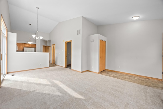21315 W Edison Ln, Plainfield, IL 60544 - unfurnished living room featuring lofted ceiling, a chandelier, baseboards, and light carpet