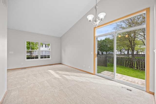 21315 W Edison Ln, Plainfield, IL 60544 - spare room with plenty of natural light, a chandelier, vaulted ceiling, and baseboards