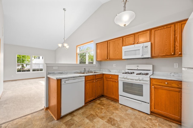 21315 W Edison Ln, Plainfield, IL 60544 - kitchen featuring white appliances, a sink, plenty of natural light, brown cabinets, and high vaulted ceiling