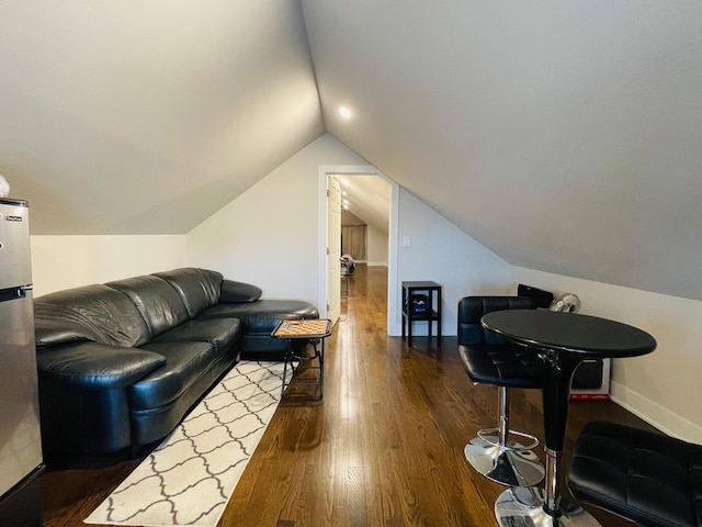 4623 S Harding Ave, Chicago, IL 60632 - living room featuring wood finished floors, vaulted ceiling, and baseboards
