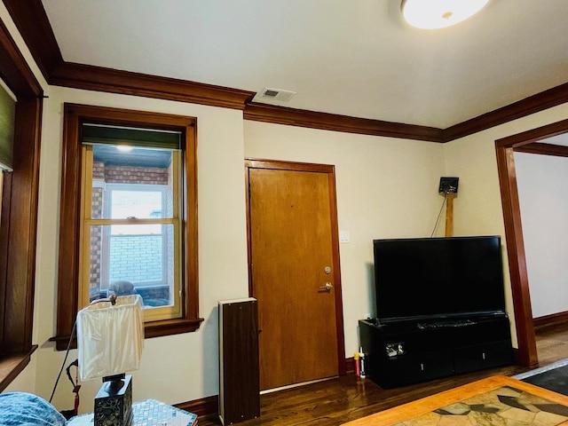 4623 S Harding Ave, Chicago, IL 60632 - living area with crown molding, wood finished floors, and baseboards