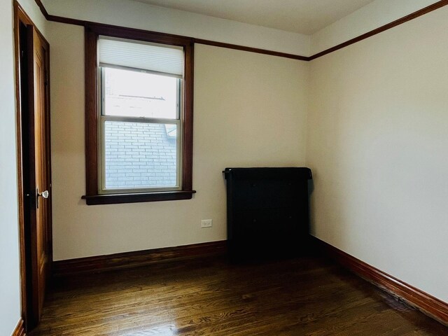 4623 S Harding Ave, Chicago, IL 60632 - unfurnished room featuring baseboards and wood finished floors