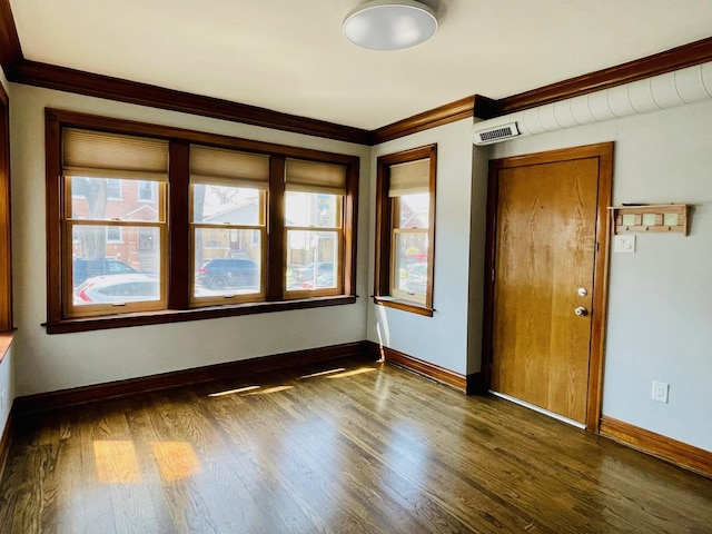4623 S Harding Ave, Chicago, IL 60632 - unfurnished room with plenty of natural light, ornamental molding, wood finished floors, and baseboards