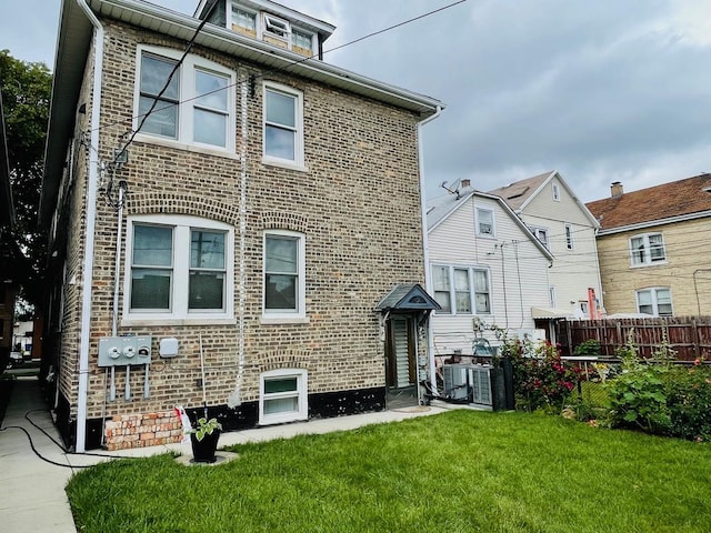 4623 S Harding Ave, Chicago, IL 60632 - rear view of property featuring brick siding and central AC unit