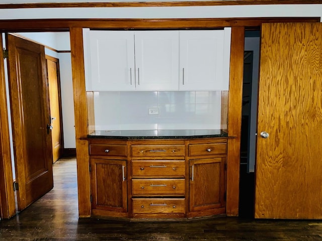 4623 S Harding Ave, Chicago, IL 60632 - kitchen featuring dark wood-type flooring, white cabinets, backsplash, and brown cabinetry