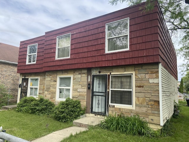 view of property featuring stone siding