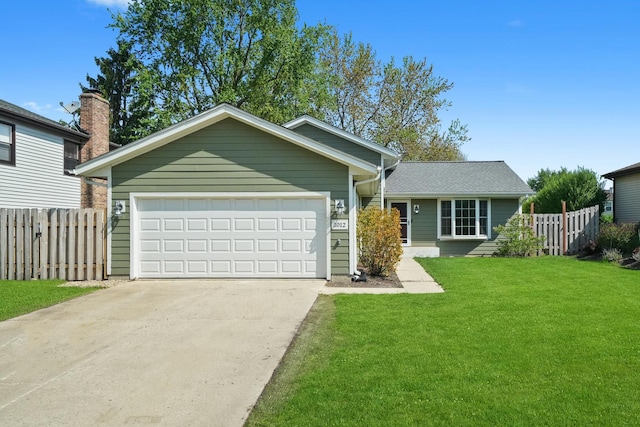 view of front facade with concrete driveway and an attached garage