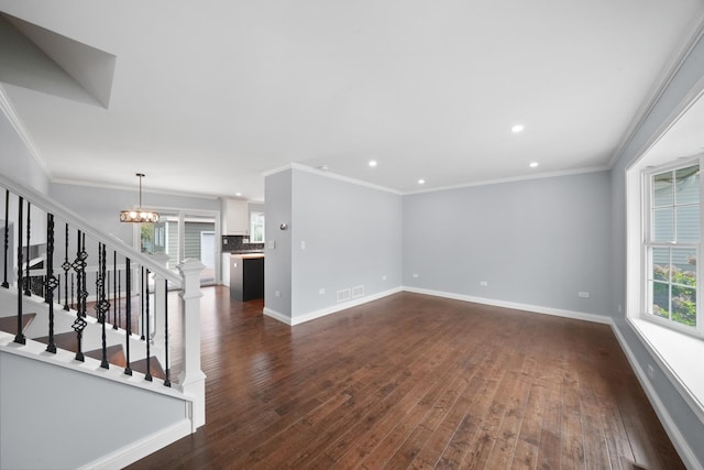 unfurnished living room featuring a chandelier, dark wood-style flooring, baseboards, recessed lighting, and stairs