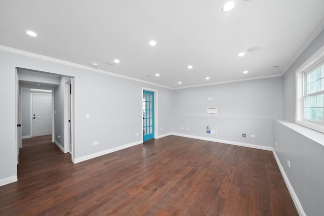 unfurnished room featuring dark wood finished floors, baseboards, crown molding, and recessed lighting