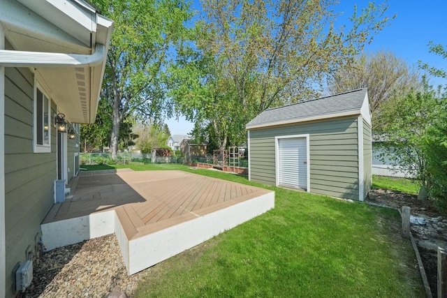 view of yard with an outbuilding and a deck