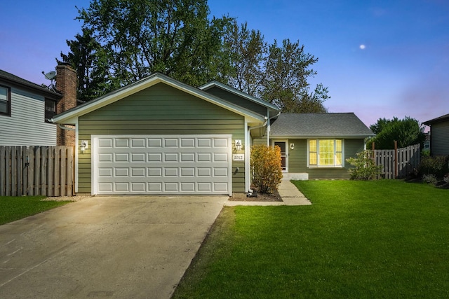 ranch-style house with concrete driveway and a garage