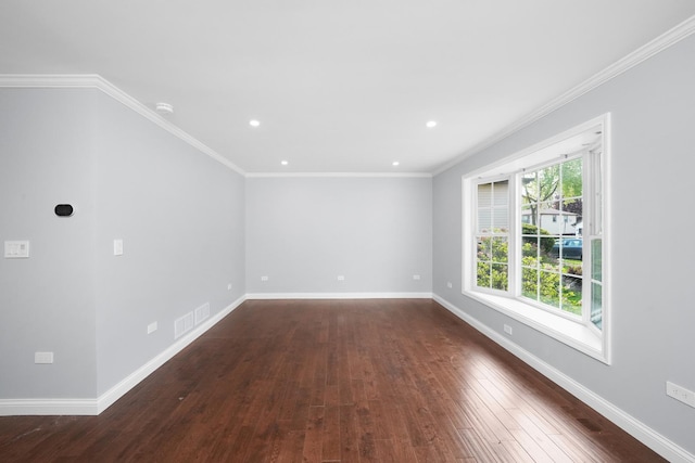 empty room with dark wood-type flooring, baseboards, recessed lighting, and crown molding