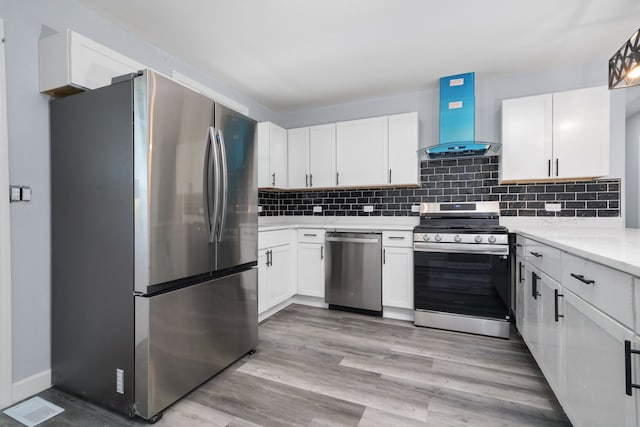 631 Fenton Ave, Romeoville, IL 60446 - kitchen with stainless steel appliances, extractor fan, white cabinetry, tasteful backsplash, and light wood-type flooring