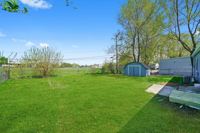 631 Fenton Ave, Romeoville, IL 60446 - view of yard with a storage unit, an outdoor structure, and central AC