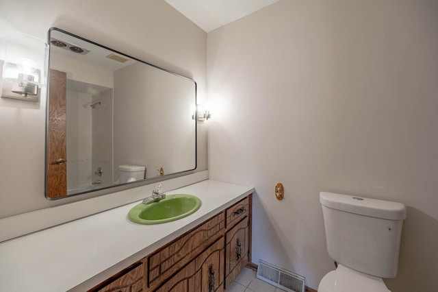 full bath featuring toilet, vanity, tile patterned floors, and bathing tub / shower combination