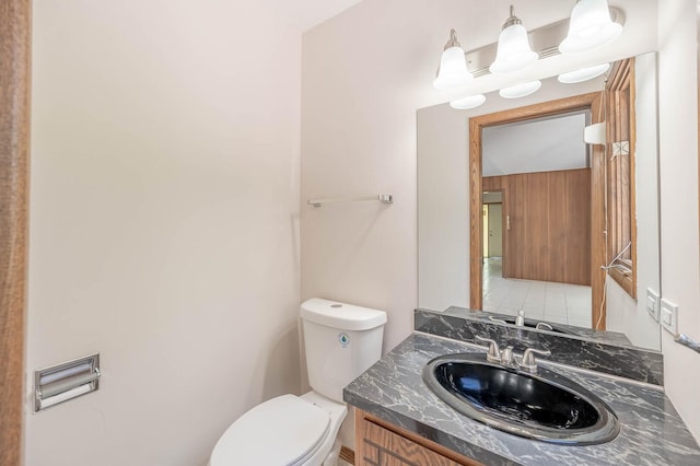 bathroom with toilet and vanity