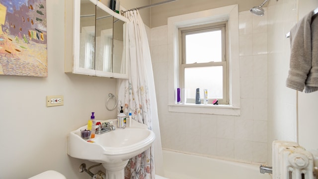 bathroom featuring radiator, shower / tub combo with curtain, and toilet