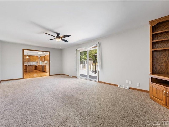 48W142 Milnamow Dr, Maple Park, IL 60151 - unfurnished living room featuring a ceiling fan and carpet floors