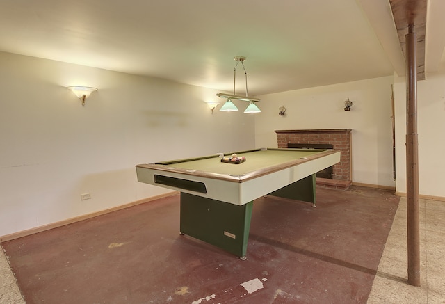 512 S Hebbard St, Joliet, IL 60433 - recreation room featuring concrete flooring, pool table, a brick fireplace, and baseboards