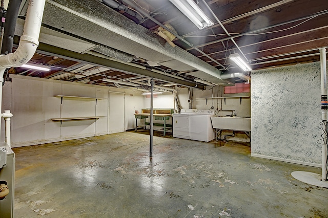 512 S Hebbard St, Joliet, IL 60433 - unfinished basement featuring washer and dryer and a sink