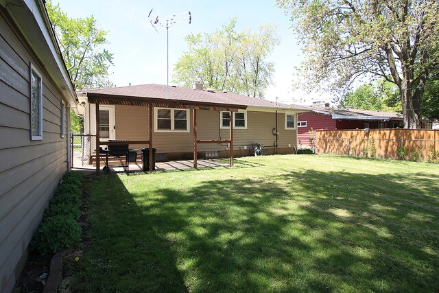 512 S Hebbard St, Joliet, IL 60433 - back of property featuring a chimney and a patio
