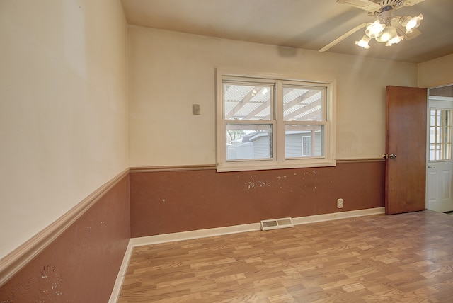 512 S Hebbard St, Joliet, IL 60433 - spare room with ceiling fan, light wood-type flooring, and baseboards