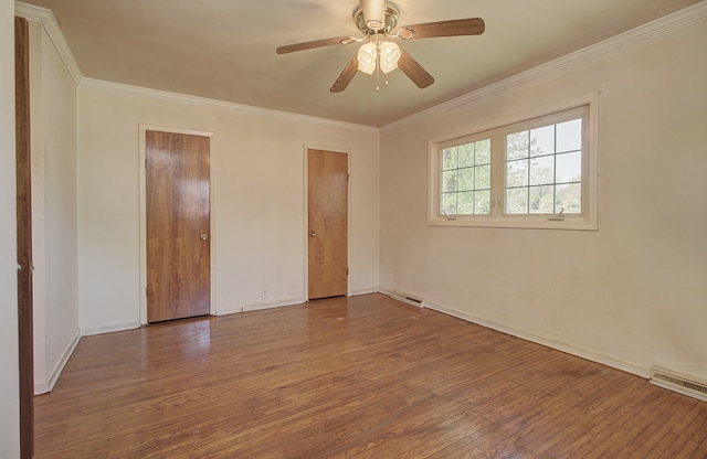 512 S Hebbard St, Joliet, IL 60433 - unfurnished bedroom with wood finished floors, crown molding, baseboards, and ceiling fan