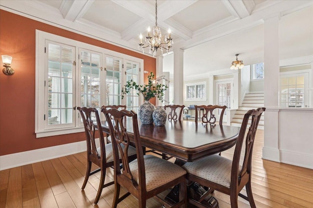 2423 Harrison St, Evanston, IL 60201 - dining room featuring a chandelier, baseboards, plenty of natural light, coffered ceiling, and light wood-style flooring