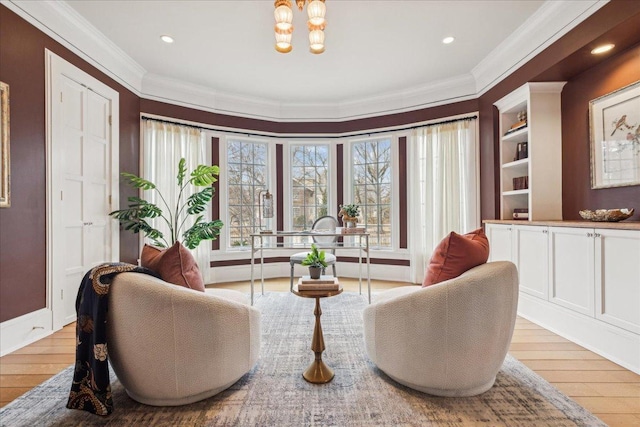 2423 Harrison St, Evanston, IL 60201 - sitting room featuring crown molding, light wood finished floors, a chandelier, recessed lighting, and built in features